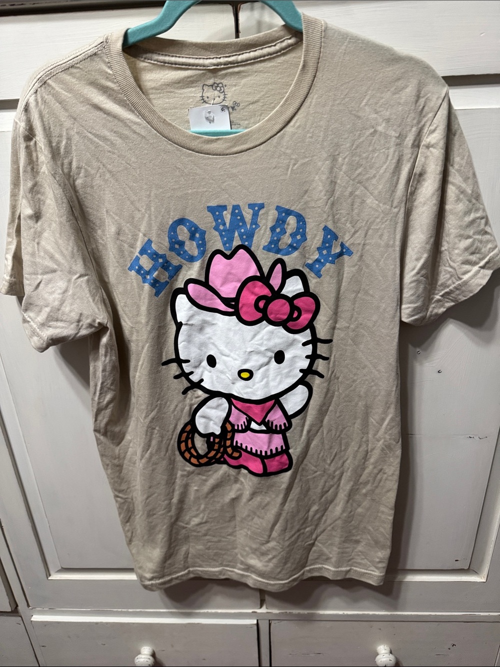 Hello Kitty Beige Tee with Pink Bow and Blue HOWDY Print